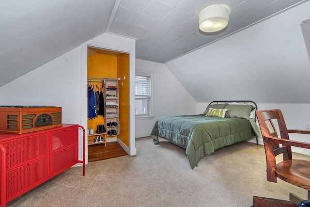 108 Needham St, Dedham, MA 02026 - carpeted bedroom featuring vaulted ceiling, a walk in closet, a closet, and baseboards