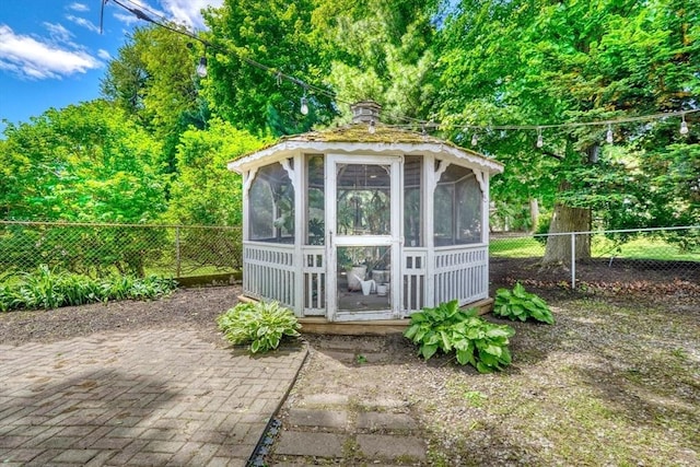 108 Needham St, Dedham, MA 02026 - view of outbuilding featuring a fenced backyard and a sunroom