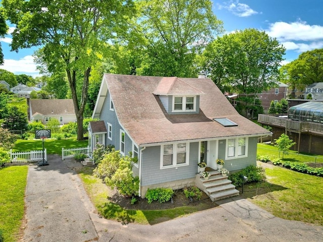 108 Needham St, Dedham, MA 02026 - view of front of property featuring a chimney, driveway, and a shingled roof