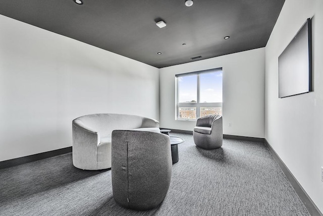 living area with carpet floors and baseboards