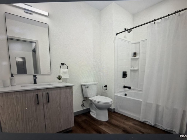 full bathroom with toilet, shower / bathtub combination with curtain, wood finished floors, and vanity