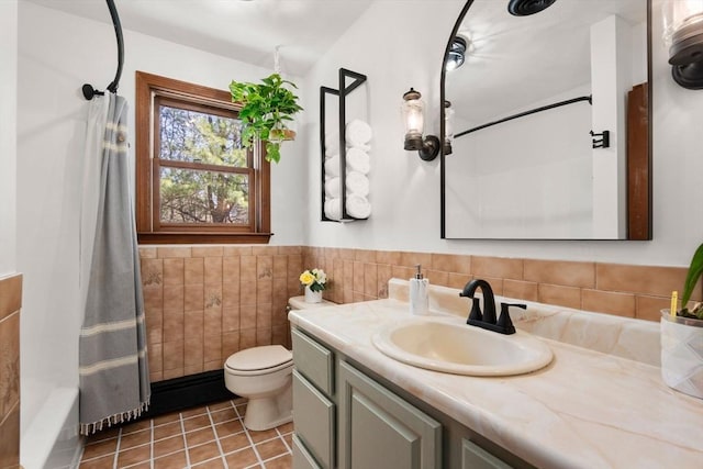 5 Crescent Ln, Sudbury, MA 01776 - bathroom with shower / tub combo, vanity, tile patterned floors, toilet, and tile walls