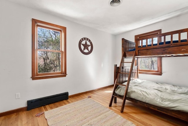 5 Crescent Ln, Sudbury, MA 01776 - bedroom with visible vents, a baseboard radiator, multiple windows, and baseboards