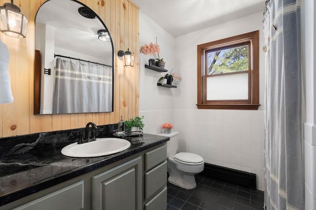 5 Crescent Ln, Sudbury, MA 01776 - full bath with tile walls, toilet, vanity, a wainscoted wall, and tile patterned flooring