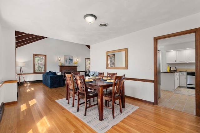 5 Crescent Ln, Sudbury, MA 01776 - dining area featuring visible vents, baseboards, light wood-type flooring, and vaulted ceiling