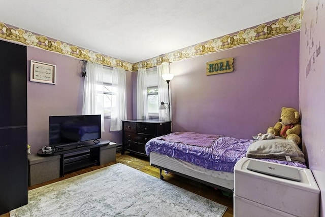 bedroom with wood finished floors
