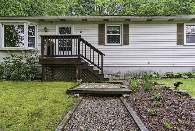 back of property featuring a lawn