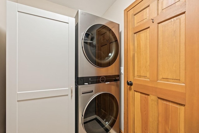 laundry area featuring stacked washer and clothes dryer