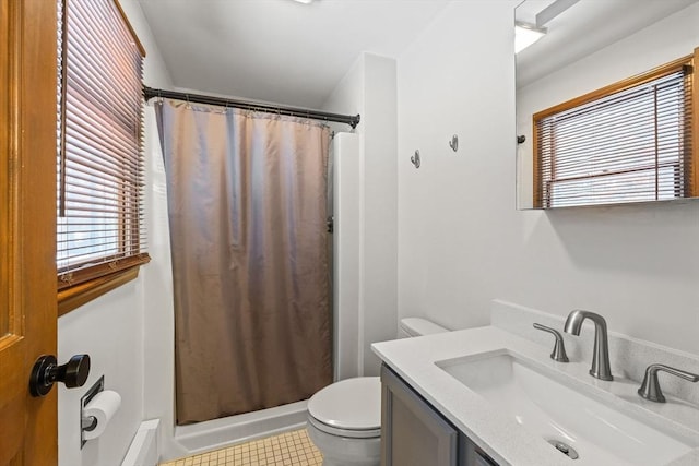 bathroom with a shower with curtain, vanity, tile patterned floors, and toilet