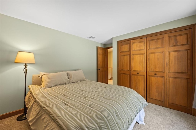 carpeted bedroom with a closet