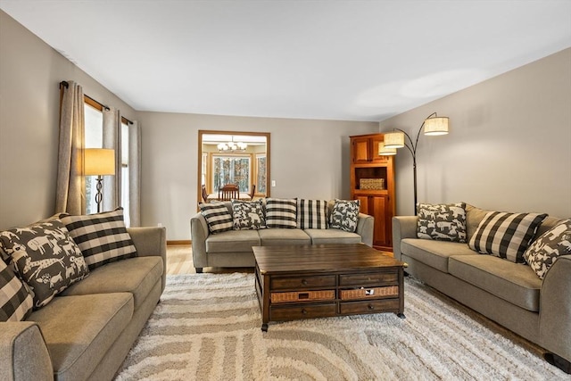 living room with an inviting chandelier