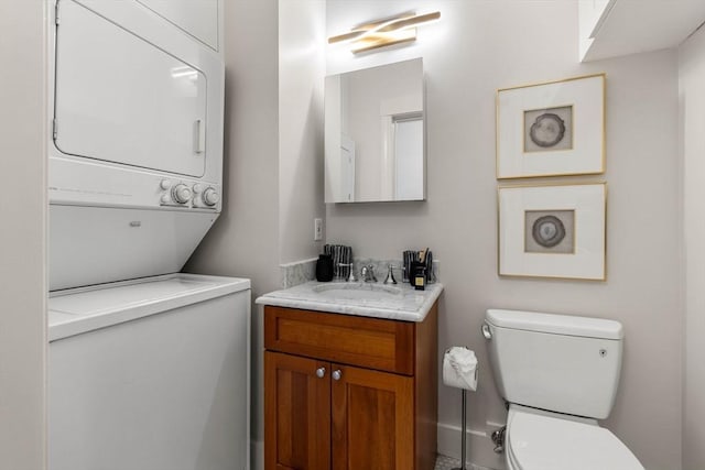 90 Broadway Unit 2C, Boston, MA 02116 - half bathroom featuring estacked washer and dryer and vanity