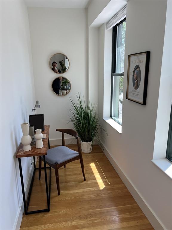 90 Broadway Unit 2C, Boston, MA 02116 - sitting room featuring light wood-style flooring and baseboards
