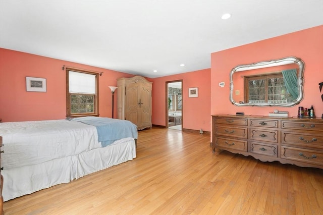 bedroom with recessed lighting and light wood-style flooring