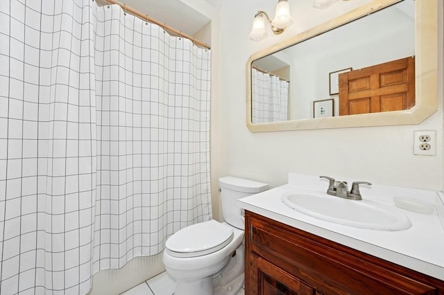 bathroom with vanity, toilet, and curtained shower