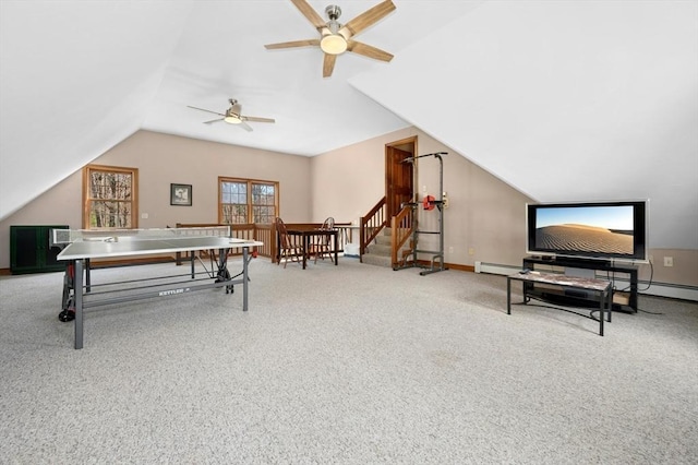 rec room featuring baseboards, ceiling fan, baseboard heating, and vaulted ceiling