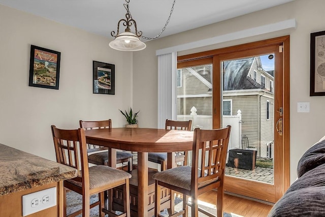 dining area with hardwood / wood-style floors