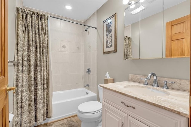 full bathroom featuring vanity, shower / tub combo, and toilet