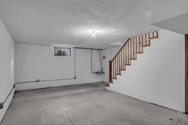 basement with a textured ceiling