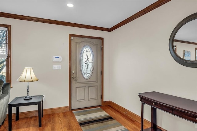 entrance foyer featuring light hardwood / wood-style flooring and ornamental molding