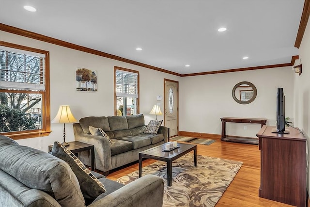 living room featuring light hardwood / wood-style flooring and ornamental molding