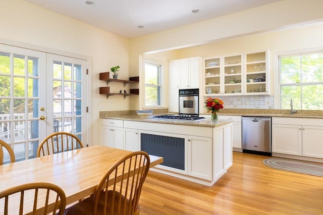 21 Waterston Rd, Newton, MA 02458 - kitchen featuring stainless steel appliances, open shelves, a sink, and healthy amount of natural light