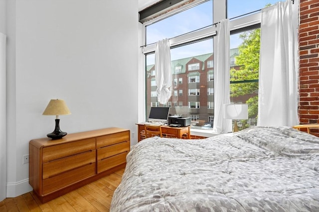 281 Essex St Unit 206, Salem, MA 01970 - bedroom featuring light wood-style flooring and access to exterior
