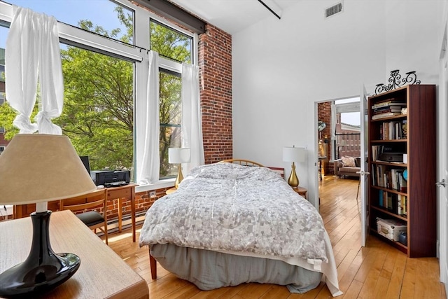 281 Essex St Unit 206, Salem, MA 01970 - bedroom with a high ceiling and light wood-style flooring