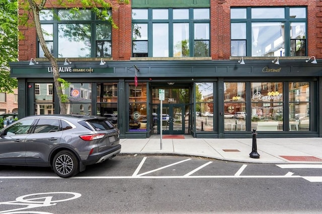 281 Essex St Unit 206, Salem, MA 01970 - property entrance with french doors, uncovered parking, and brick siding