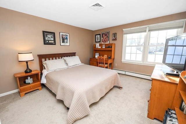 bedroom featuring light carpet, baseboard heating, baseboards, and visible vents