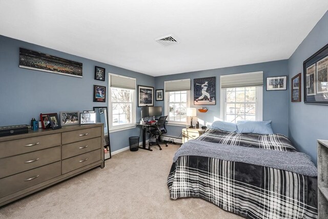 bedroom featuring visible vents, baseboards, and light colored carpet