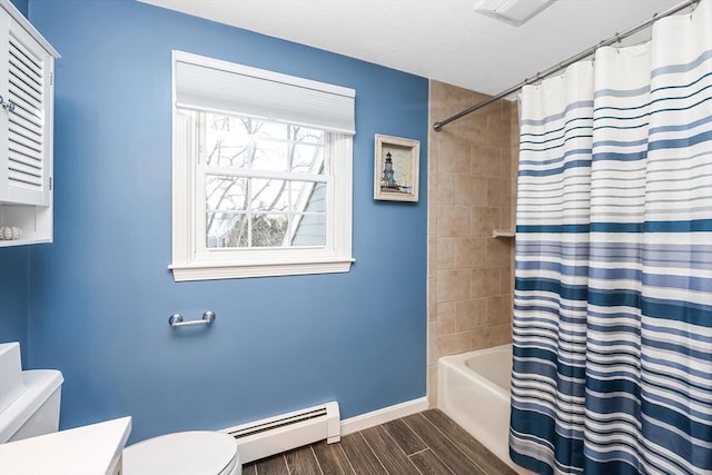 bathroom featuring wood finish floors, toilet, shower / tub combo with curtain, a baseboard heating unit, and baseboards