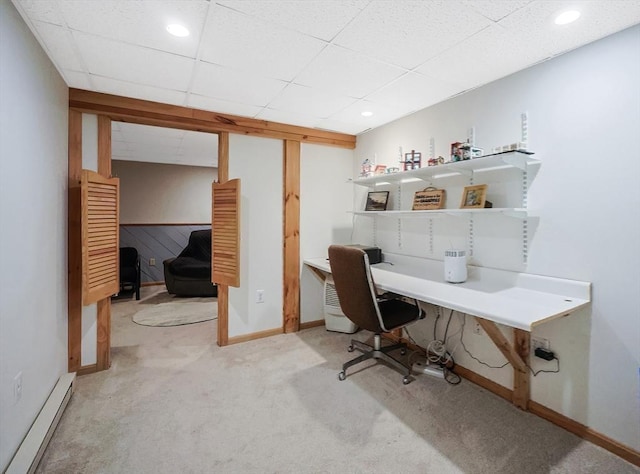 office area featuring a baseboard heating unit, baseboards, carpet flooring, recessed lighting, and a paneled ceiling