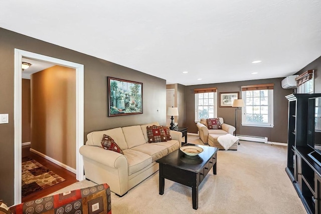 living room featuring baseboards, recessed lighting, an AC wall unit, light colored carpet, and baseboard heating