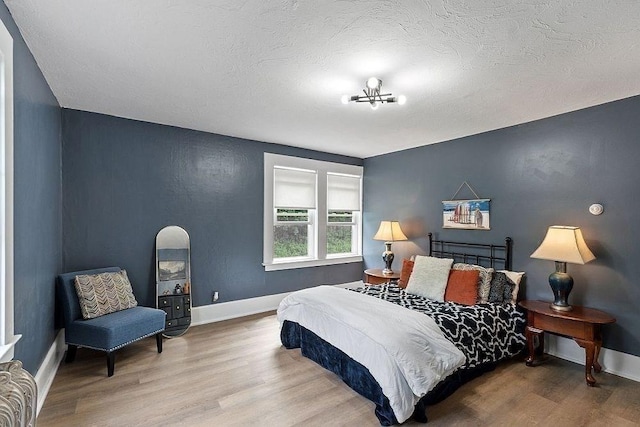 8 Holman St, Templeton, MA 01436 - bedroom featuring wood finished floors and a textured ceiling