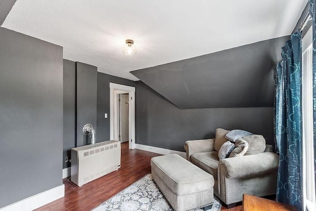 8 Holman St, Templeton, MA 01436 - sitting room with wood finished floors, lofted ceiling, and heating unit