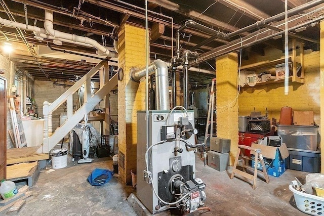8 Holman St, Templeton, MA 01436 - unfinished basement featuring a heating unit and stairway