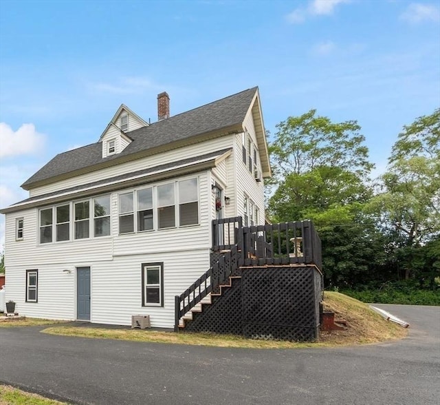 8 Holman St, Templeton, MA 01436 - view of side of property featuring a chimney, stairway, a shingled roof, and a wooden deck