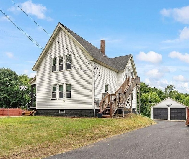 8 Holman St, Templeton, MA 01436 - view of property exterior featuring stairway, an outdoor structure, a chimney, a detached garage, and a yard