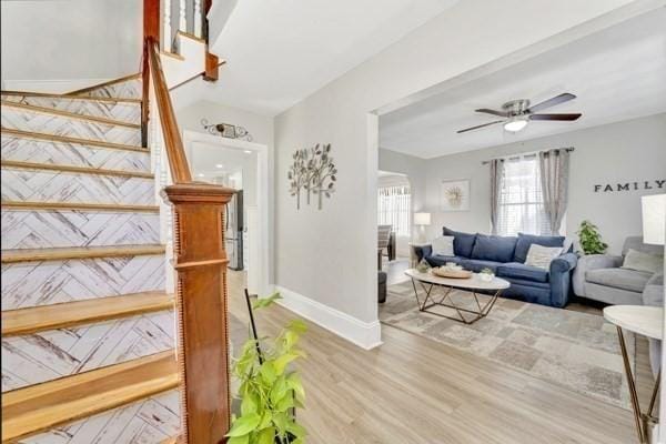 135 Pine Grove Ave, Lynn, MA 01904 - living room featuring wood finished floors, stairway, ceiling fan, and baseboards
