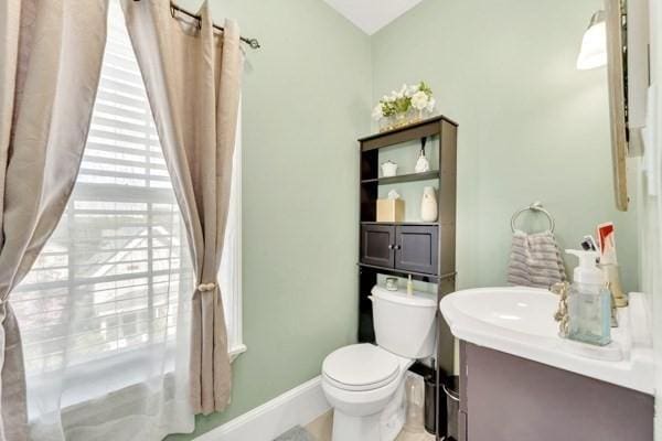 135 Pine Grove Ave, Lynn, MA 01904 - bathroom featuring vanity, toilet, and baseboards