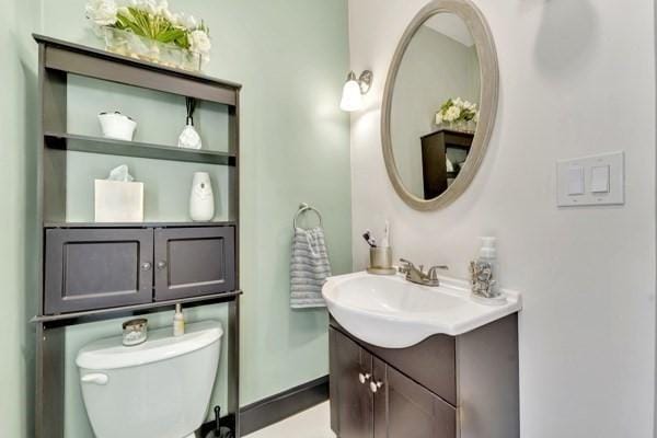 135 Pine Grove Ave, Lynn, MA 01904 - bathroom featuring vanity, toilet, and baseboards