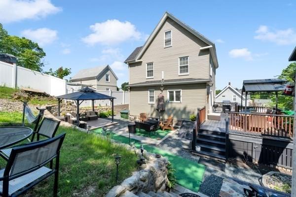 135 Pine Grove Ave, Lynn, MA 01904 - rear view of property with a gazebo, a wooden deck, a fenced backyard, and a patio