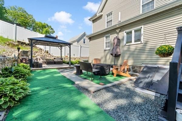 135 Pine Grove Ave, Lynn, MA 01904 - back of house featuring an outdoor living space, a gazebo, and a patio area