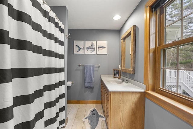 bathroom with recessed lighting, tile patterned flooring, vanity, baseboards, and curtained shower