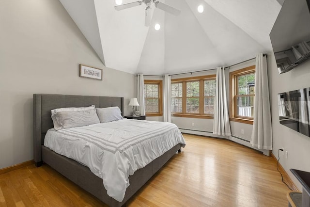 bedroom featuring recessed lighting, light wood-style flooring, baseboards, lofted ceiling, and a baseboard radiator