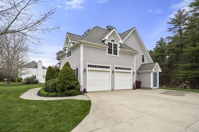 view of property exterior featuring driveway, a yard, and an attached garage
