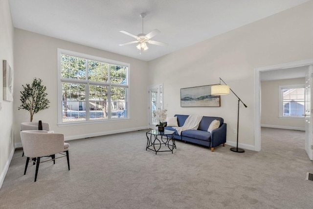 living room with ceiling fan and light carpet