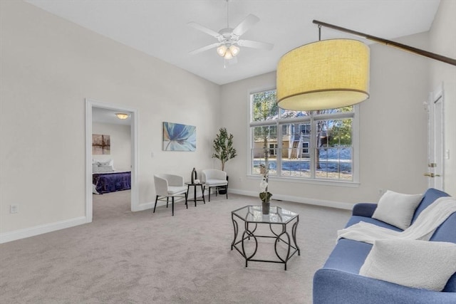 living room with ceiling fan and carpet floors