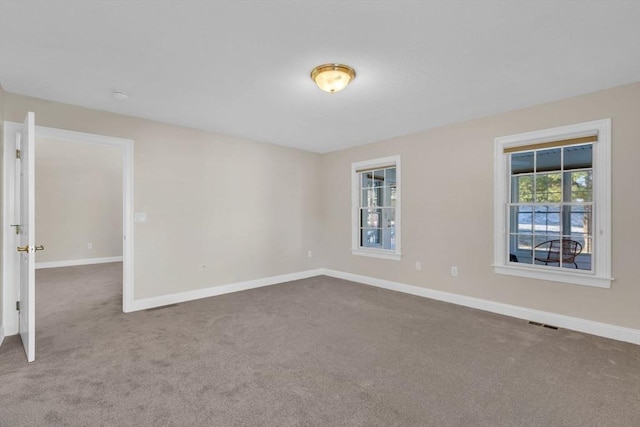 unfurnished room featuring carpet flooring